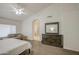 Spacious primary bedroom with carpet, ensuite bathroom access and comfortable seating at 3834 E Windsong Dr, Phoenix, AZ 85048