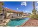 Gorgeous pool and spa, surrounded by mature landscaping and a covered patio at 3834 E Windsong Dr, Phoenix, AZ 85048