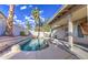 Private backyard oasis featuring a pool, spa, and mature landscaping at 3834 E Windsong Dr, Phoenix, AZ 85048