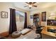 Bedroom with desk and chair setup, a window with curtains, and wood-look flooring at 3926 W Christy Dr, Phoenix, AZ 85029