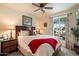 Cozy bedroom featuring a large window, plush carpet, and ample natural light at 3926 W Christy Dr, Phoenix, AZ 85029