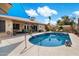 Backyard pool featuring shaded seating areas, mature landscaping, and decorative accents at 3926 W Christy Dr, Phoenix, AZ 85029