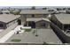 Aerial view of the backyard with gravel landscaping and a covered patio at 40893 W Bedford Dr, Maricopa, AZ 85138
