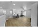 Large loft space with multiple windows and ceiling fan offers flexible living at 40893 W Bedford Dr, Maricopa, AZ 85138