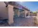 Inviting covered back patio featuring a brick paver floor and mature landscaping for outdoor enjoyment at 4116 E Sunnyside Dr, Phoenix, AZ 85028