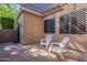 Inviting covered back patio features brick flooring and seating area, great for entertaining or relaxing at 4116 E Sunnyside Dr, Phoenix, AZ 85028