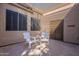Relaxing covered patio with brick flooring and outdoor seating, ideal for enjoying the Arizona weather at 4116 E Sunnyside Dr, Phoenix, AZ 85028