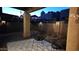 Backyard view showing a decorative patio, covered area, decorative fence and outdoor lighting and modern chairs at 4116 E Sunnyside Dr, Phoenix, AZ 85028