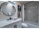 This remodeled bathroom has a tub and shower combination with decorative wall art at 4116 E Sunnyside Dr, Phoenix, AZ 85028
