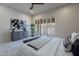 Bright bedroom with modern decor, shuttered windows and hardwood floors at 4116 E Sunnyside Dr, Phoenix, AZ 85028