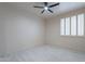Bedroom with a ceiling fan and window bringing natural light into the room at 4116 E Sunnyside Dr, Phoenix, AZ 85028