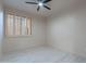 Bedroom with plantation shutters and light-colored wood flooring at 4116 E Sunnyside Dr, Phoenix, AZ 85028
