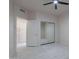 Bedroom features mirrored closet and easy access to the attached bathroom at 4116 E Sunnyside Dr, Phoenix, AZ 85028