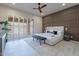 Modern bedroom featuring wood-slat accent wall, neutral color palette, and shuttered windows at 4116 E Sunnyside Dr, Phoenix, AZ 85028