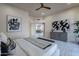 Spacious bedroom with a view into dining area, neutral decor, and shuttered windows at 4116 E Sunnyside Dr, Phoenix, AZ 85028