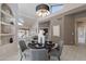 Dining area offering a statement chandelier and decor, and shuttered windows at 4116 E Sunnyside Dr, Phoenix, AZ 85028