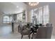 Eat-in kitchen and dining area featuring natural light, modern decor, and seating for four at 4116 E Sunnyside Dr, Phoenix, AZ 85028