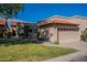 Beautiful home with a well-manicured lawn, paver driveway, and an attached two-car garage at 4116 E Sunnyside Dr, Phoenix, AZ 85028