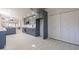 Modern kitchen features stylish gray cabinets, stainless steel appliances, and white countertops at 4116 E Sunnyside Dr, Phoenix, AZ 85028