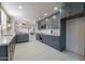 Modern kitchen features stylish gray cabinets, stainless steel appliances, and white countertops at 4116 E Sunnyside Dr, Phoenix, AZ 85028