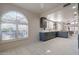 Modern kitchen features stylish gray cabinets, stainless steel appliances, and white countertops at 4116 E Sunnyside Dr, Phoenix, AZ 85028