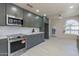 Contemporary kitchen featuring stainless steel appliances, sleek cabinetry, and ample counter space at 4116 E Sunnyside Dr, Phoenix, AZ 85028