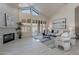 Beautifully lit living room features a fireplace, large painting, and modern furniture on a gray rug at 4116 E Sunnyside Dr, Phoenix, AZ 85028
