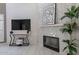 Bright living area featuring a modern fireplace, stylish decor, and sleek entertainment console at 4116 E Sunnyside Dr, Phoenix, AZ 85028