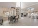 Bright, open living space with vaulted ceilings, a fireplace, and floor-to-ceiling shutters at 4116 E Sunnyside Dr, Phoenix, AZ 85028