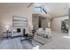 Inviting living room with vaulted ceilings, comfortable seating, and contemporary decor showcasing bright and airy space at 4116 E Sunnyside Dr, Phoenix, AZ 85028