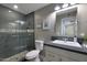 Bathroom featuring a tiled walk-in shower and a single vanity with modern fixtures at 4248 N Parkway Ave, Scottsdale, AZ 85251