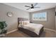 Cozy bedroom features plush bed, neutral palette and modern ceiling fan at 4248 N Parkway Ave, Scottsdale, AZ 85251