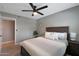 Bedroom featuring plush queen bed, neutral palette and modern ceiling fan at 4248 N Parkway Ave, Scottsdale, AZ 85251