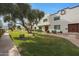 Charming townhome community with lush landscaping, mature trees, and well-maintained sidewalks at 4248 N Parkway Ave, Scottsdale, AZ 85251