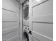 Stacked washer and dryer are visible through the doorway of the laundry room at 4248 N Parkway Ave, Scottsdale, AZ 85251