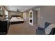 Spacious main bedroom featuring a ceiling fan, barn door entry to the ensuite, and a king bed at 4248 N Parkway Ave, Scottsdale, AZ 85251
