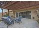 Charming outdoor patio with pergola features comfortable seating, ideal for relaxing and entertaining at 4248 N Parkway Ave, Scottsdale, AZ 85251