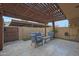 Serene outdoor patio with comfortable seating, pergola, and neutral tones offers a relaxing space at 4248 N Parkway Ave, Scottsdale, AZ 85251