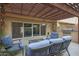 Inviting covered patio features tile flooring and comfortable seating, perfect for outdoor relaxation and entertaining at 4248 N Parkway Ave, Scottsdale, AZ 85251