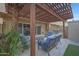 Inviting covered patio features tile flooring and comfortable seating, perfect for outdoor relaxation and entertaining at 4248 N Parkway Ave, Scottsdale, AZ 85251