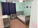 Charming bedroom with gray crib, cute decorations, and ceiling fan at 42775 W Jeremy St, Maricopa, AZ 85138