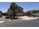 Two-story home with a two-car garage, desert landscaping, and tile roof at 42775 W Jeremy St, Maricopa, AZ 85138