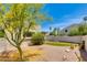 Charming backyard featuring desert landscaping, lush greenery, and a serene atmosphere at 4317 E Glenrosa Ave, Phoenix, AZ 85018