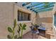 Private courtyard featuring a pergola, cactus, an outdoor table and seating at 4317 E Glenrosa Ave, Phoenix, AZ 85018