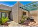 View of the private courtyard with pavers, desert landscaping, a pergola and an outdoor table with chairs at 4317 E Glenrosa Ave, Phoenix, AZ 85018