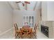 Cozy dining area with a fireplace, beamed ceilings, and outdoor access at 4317 E Glenrosa Ave, Phoenix, AZ 85018