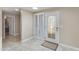 Bright foyer with tile floors, leading to the bathroom and the doorway to other rooms at 4317 E Glenrosa Ave, Phoenix, AZ 85018