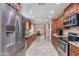 Bright eat-in kitchen with ample wood cabinets, granite countertops, and stainless steel appliances at 4317 E Glenrosa Ave, Phoenix, AZ 85018