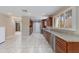 Spacious kitchen featuring wood cabinets, granite countertops, and modern stainless steel appliances at 4317 E Glenrosa Ave, Phoenix, AZ 85018