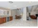 Bright, open-concept featuring a dining area and kitchen with wood cabinets and granite countertops at 4317 E Glenrosa Ave, Phoenix, AZ 85018